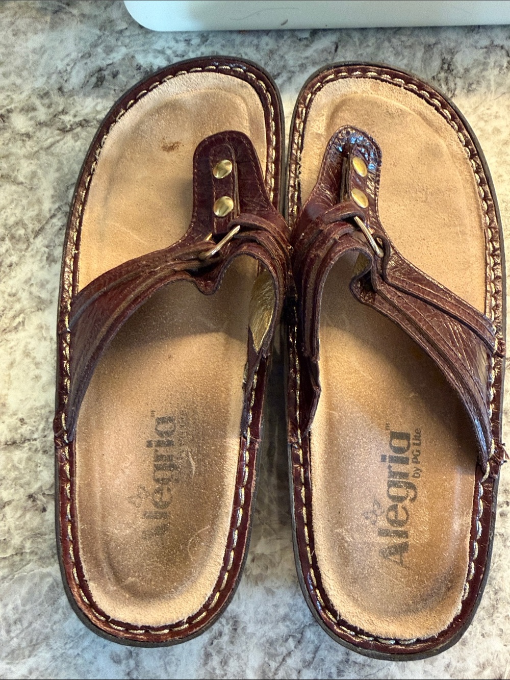 Alegria Women’s Brown Leather Toe-Post Sandals with Brass Accents
